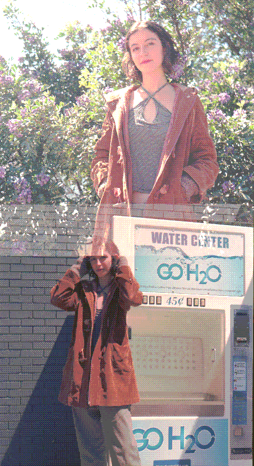 Carol standing in front of an ice machine